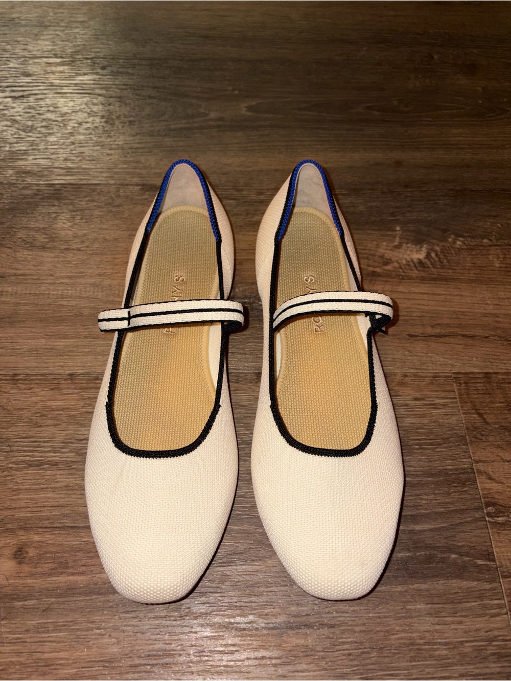 Rothy's Cream Mary Jane Flats with Black Trim and Blue Accent